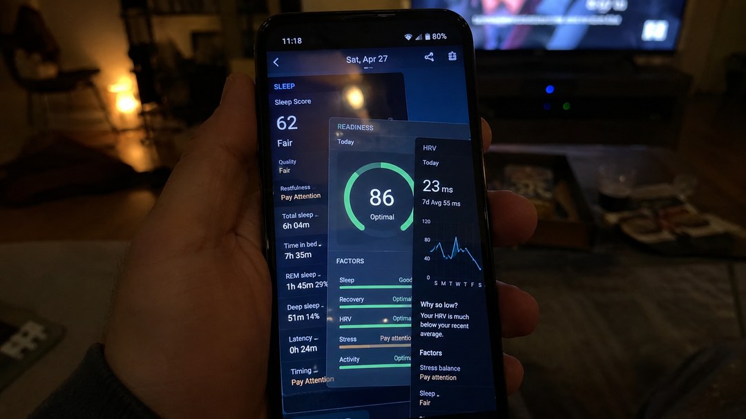 A phone at night showing a sleep score, readiness score and HRV chart